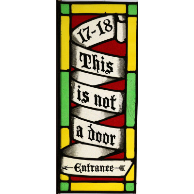 Our home in Hastings is actually two 17th-century houses knocked into one, so we have two front doors. People always used to call at the wrong door, so I put in this panel to redirect them.